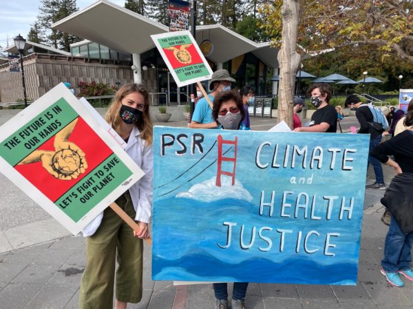 psr members holding sign for climate health at Nov 6 march