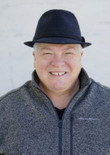 Marj Headshot cropped Marj Plumb in a cool black hat