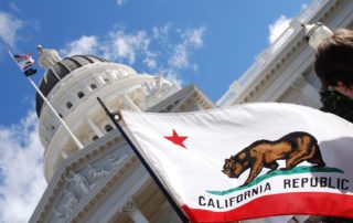 CA capitol building and flag