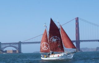 sail boat in front of Golden Gate bridge