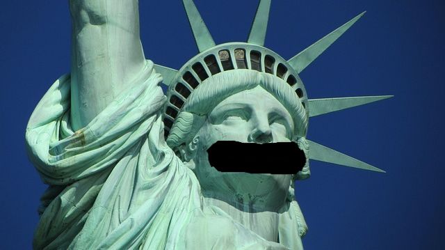 Statute of Liberty with a gag on her mouth