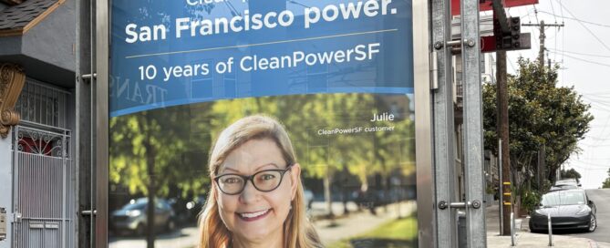 bu stop shelter on San Francisco street with image of middle-aged, blond medium length hair woman smiling