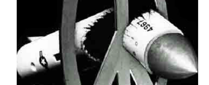 a peace symbol breaking a bomb in half